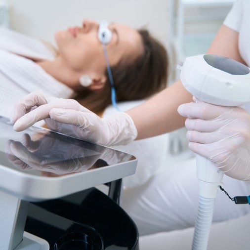 Doctor and patient in the office before the photorejuvenation procedure